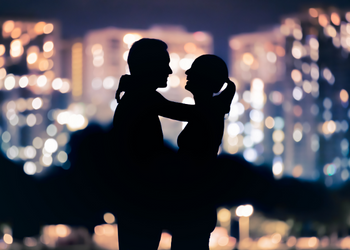 Couple In front of helicopter Kissing